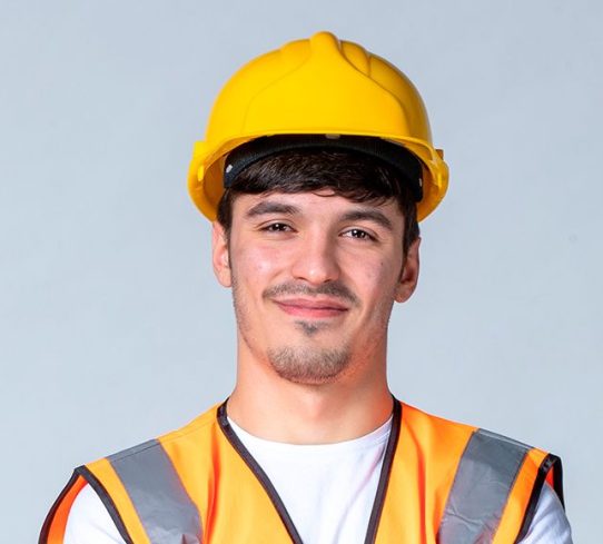front-view-male-builder-uniform-yellow-helmet-white-wall